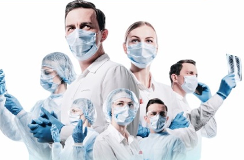 Medical team in scrubs and masks
